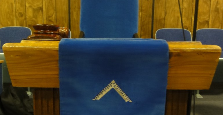 The Worshipful Master's Station in the East with Jewel, Apron, and Gavel.
