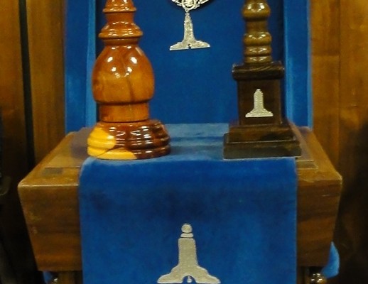 The Chair in the West, with jewel, apron, pillar, and gavel.