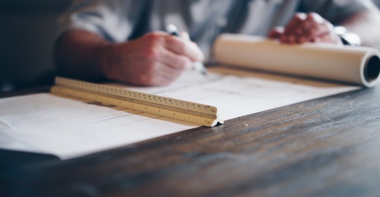 Picture of an architect making plans